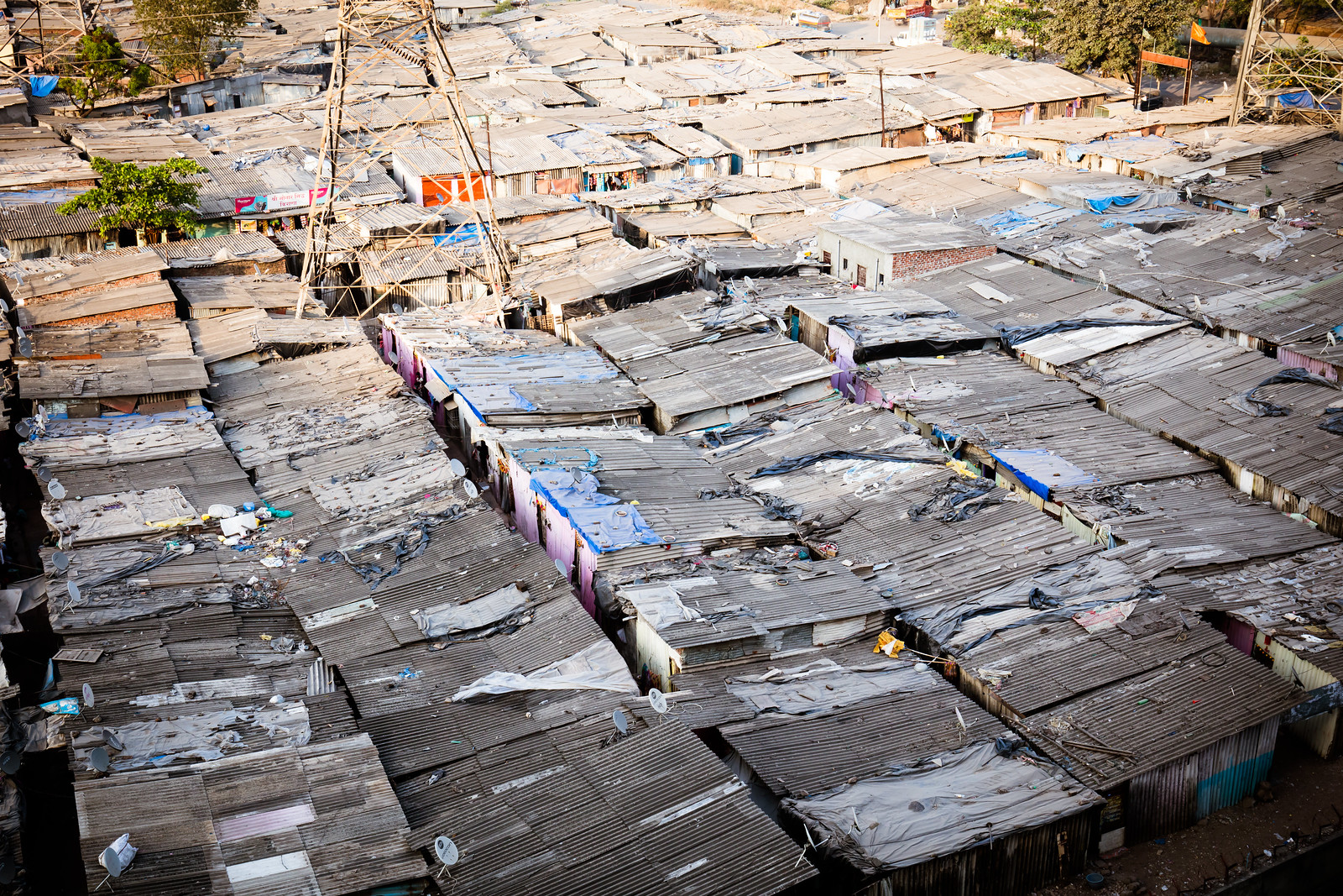 Rooftops at sunset of a slum in the district of Airoli in Mumbai, India Rooftops at sunset of a slum in the district of Airoli in Mumbai, India