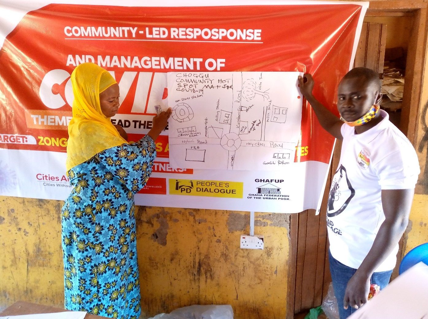 A man and a women in Ghana during a Covid-19 management training in Ghana
