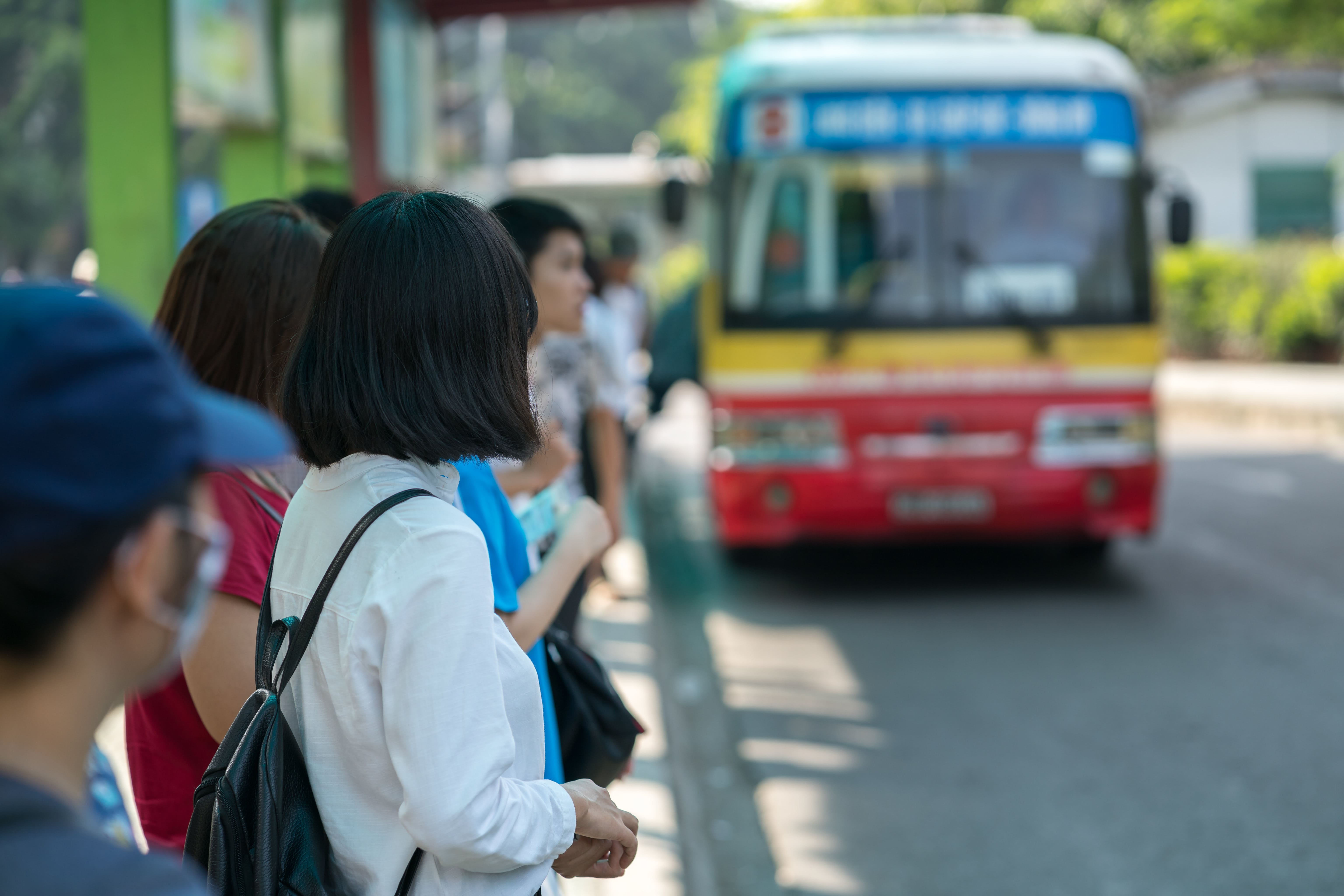 Young girl waiting for bus at bus station. Closeup_Credits_Cities Alliance.jpg