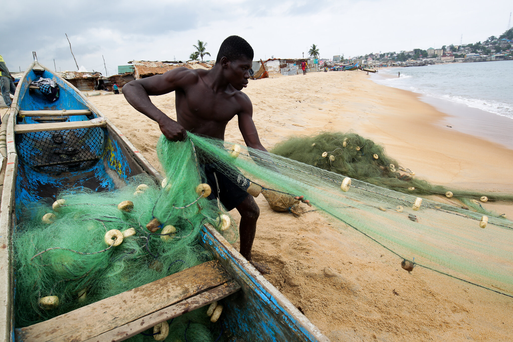 Fisherman in West Point, slum community in Monrovia, Liberia