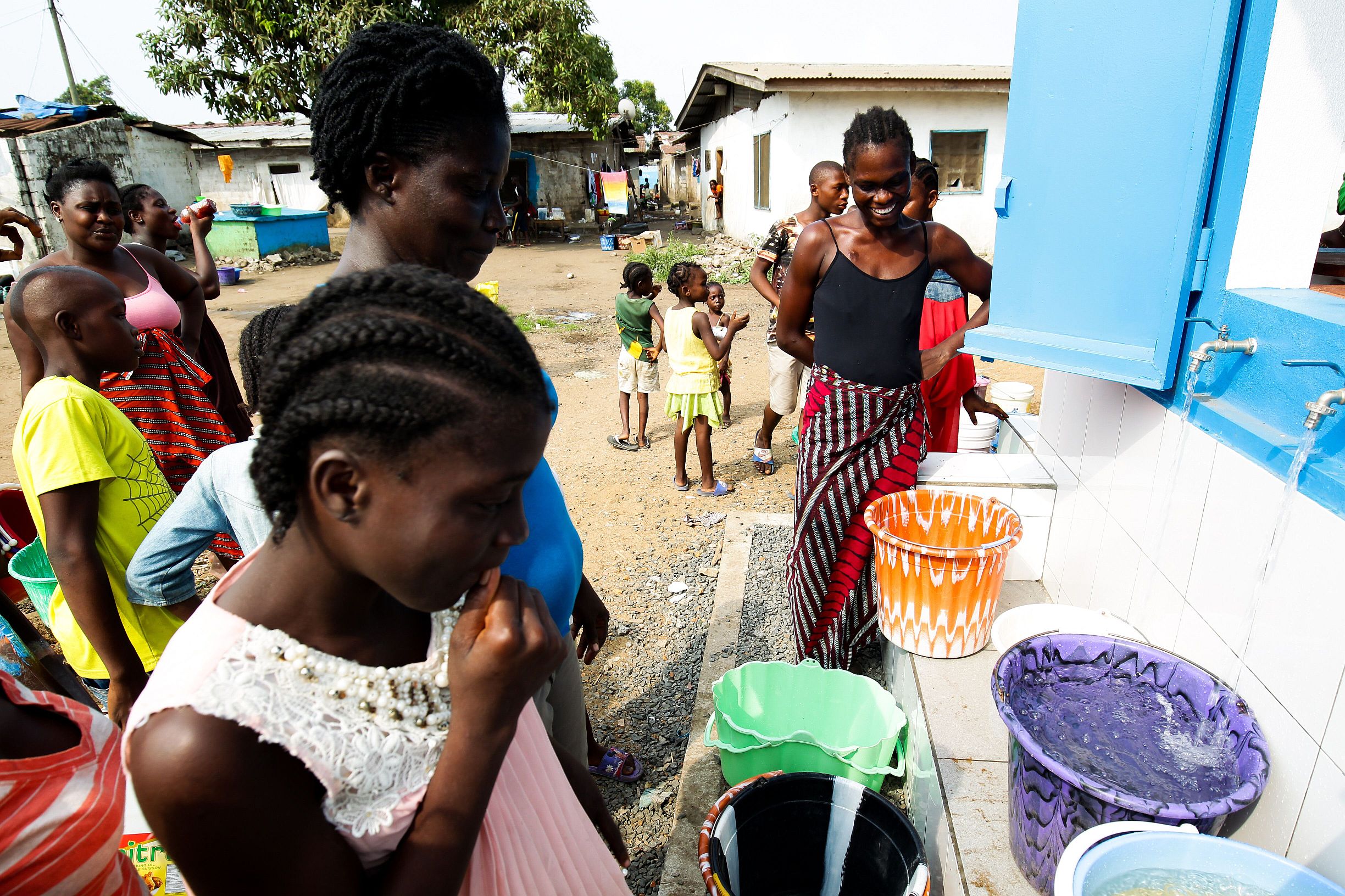 Women at a water point. Monrovia, Liberia Women at a water point. Monrovia, Liberia