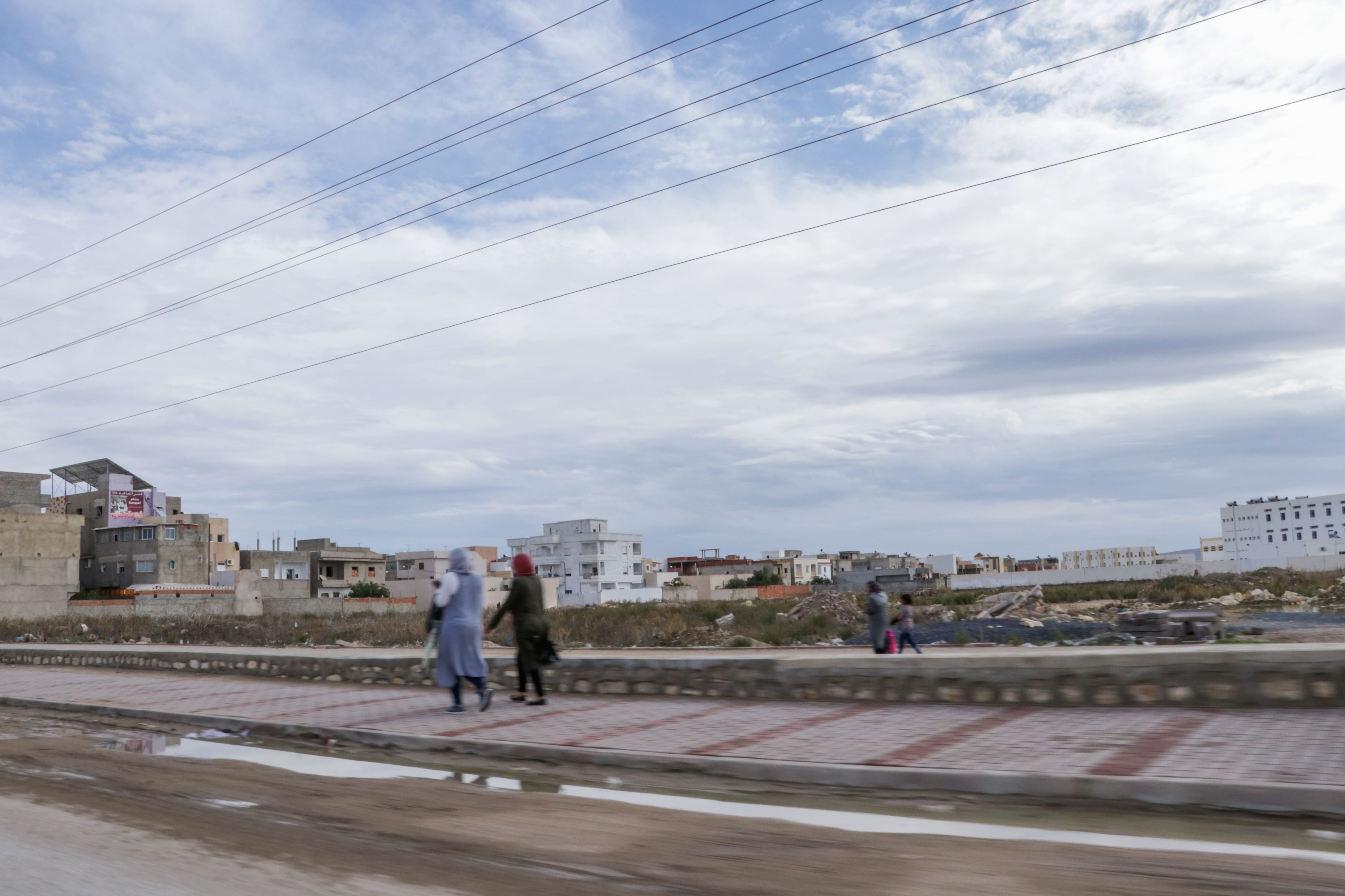 Women walking along a street in the MENA region.