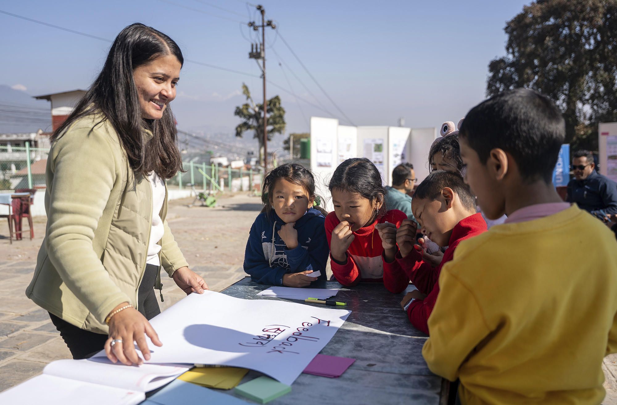 Padma listens to children’s suggestions during a community outreach session Padma listens to children’s suggestions during a community outreach session