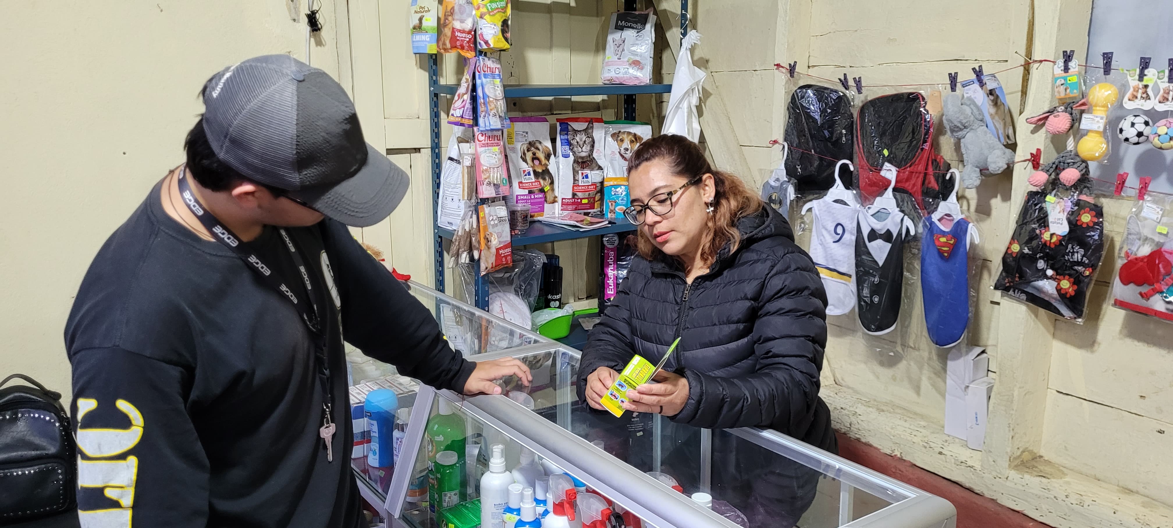 Maritza Castro talks with a customer at her pet product store in San Marcos, Guatemala. Credit: Jaqueline Barrios. Maritza Castro talks with a customer at her pet product store in San Marcos, Guatemala. Credit: Jaqueline Barrios.