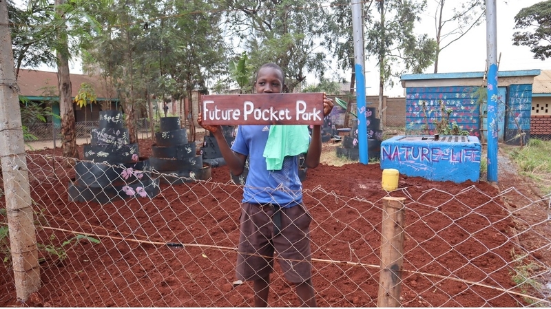 Child in a Carbon Sink Pocket Park created by Hope Raisers in Kenya. Photo: Hope Raisers