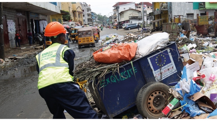 Waste picker managing waste from West Point slum community. 