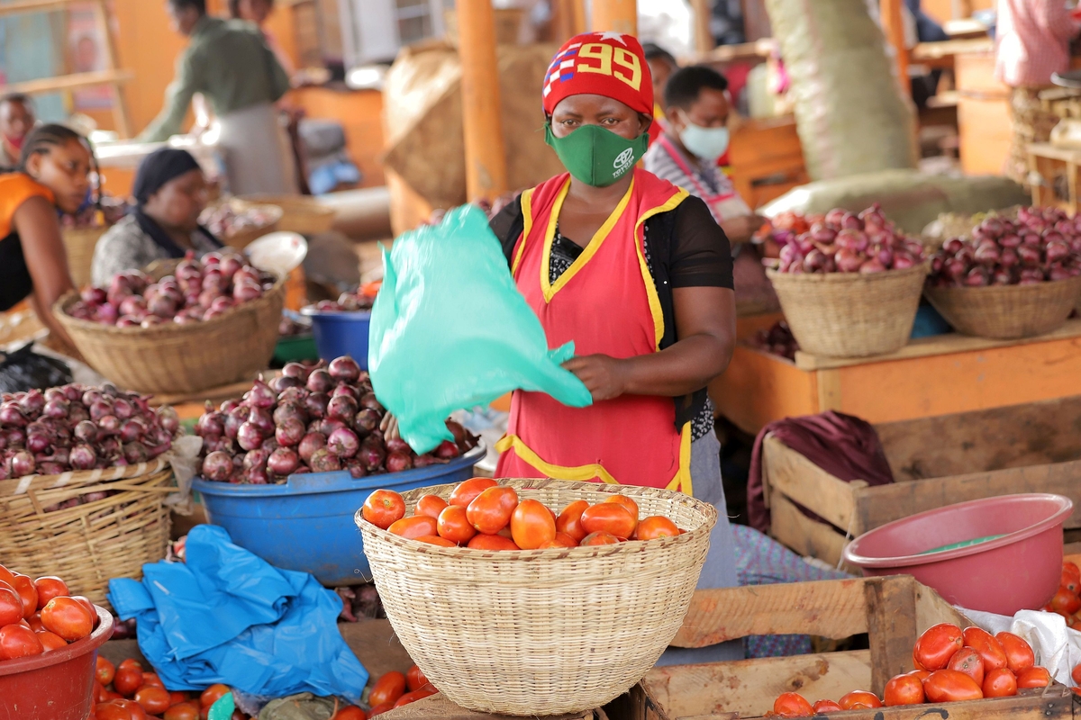 Informal vendor in a market in Kampala, Uganda Informal vendor in a market in Kampala, Uganda