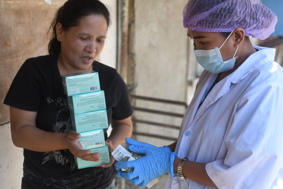 Two women during the Covid response. Photo: Roots of Health, Philippines Two women during the Covid response. Photo: Roots of Health, Philippines