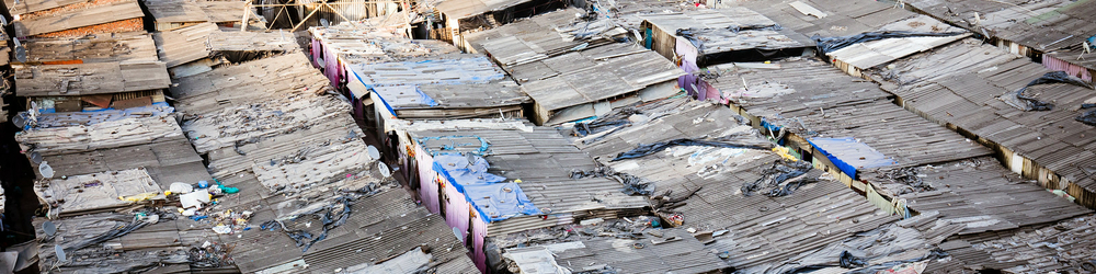 Rooftops at sunset of a slum in the district of Airoli in Mumbai, India Rooftops at sunset of a slum in the district of Airoli in Mumbai, India