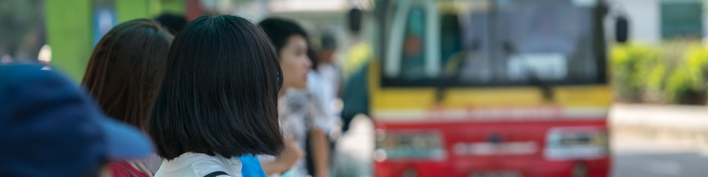 Young girl waiting for bus at bus station. Closeup_Credits_Cities Alliance.jpg