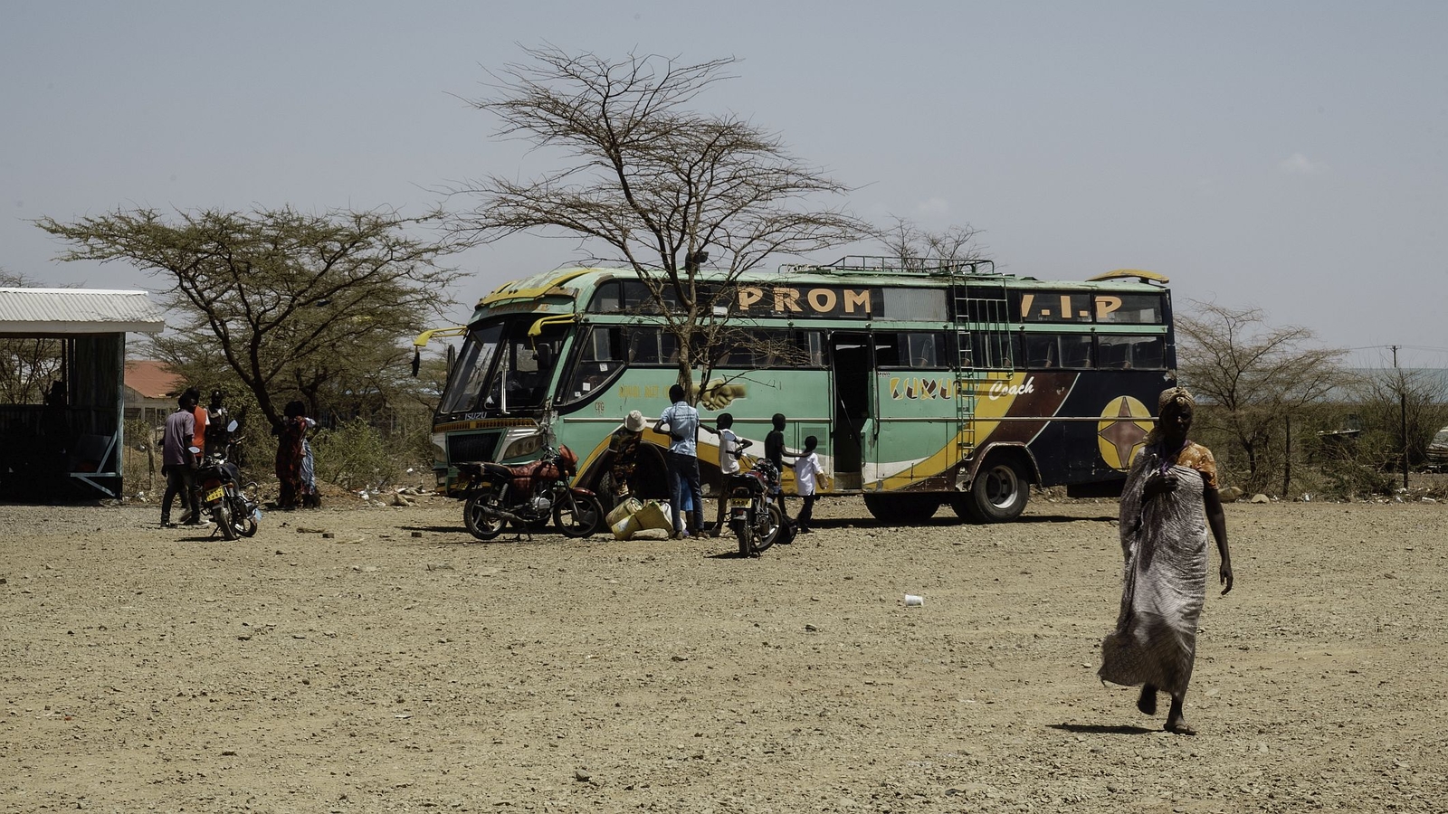 Woman at a bus stop, Kakuma, Kenya